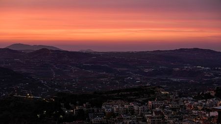 A UN post overlooks the so-called Alpha Line that separates the Israeli-occupied Golan Heights from Syria, near the town of Majdal Shams, early Tuesday, Dec. 10, 2024. 