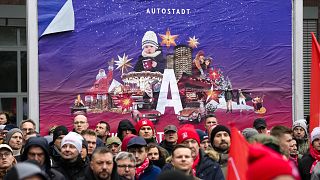 IG Metall union members protest in front of the HQ of car maker Volkswagen in Wolfsburg, Germany