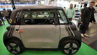 A small cheap electric Opel Rocks-e car under €10,000 by the Stellantis Group is on display at the Essen Motor Show in Essen, Germany