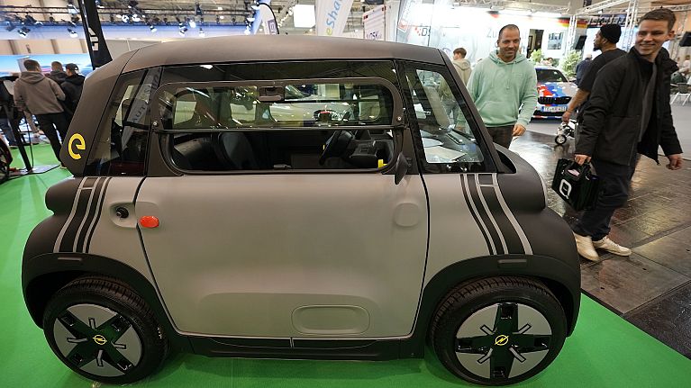 A small cheap electric Opel Rocks-e car under €10,000 by the Stellantis Group is on display at the Essen Motor Show in Essen, Germany