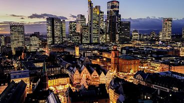 A Christmas market in Roemerberg square with the main business district in Frankfurt, Germany