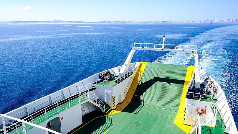 On the top deck of a ferry