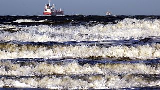 Storm battered waves photographed off the Baltic Sea Coast near Warnemuende, eastern Germany Wednesday Jan. 4, 2017.