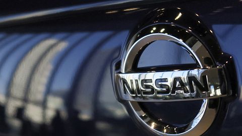 The emblem of Nissan Motor Co. is seen on a car at its global headquarters in Yokohama, near Tokyo