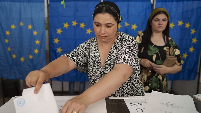 Women cast their votes in European and local elections in Baleni, Romania, Sunday, June 9, 2024. 