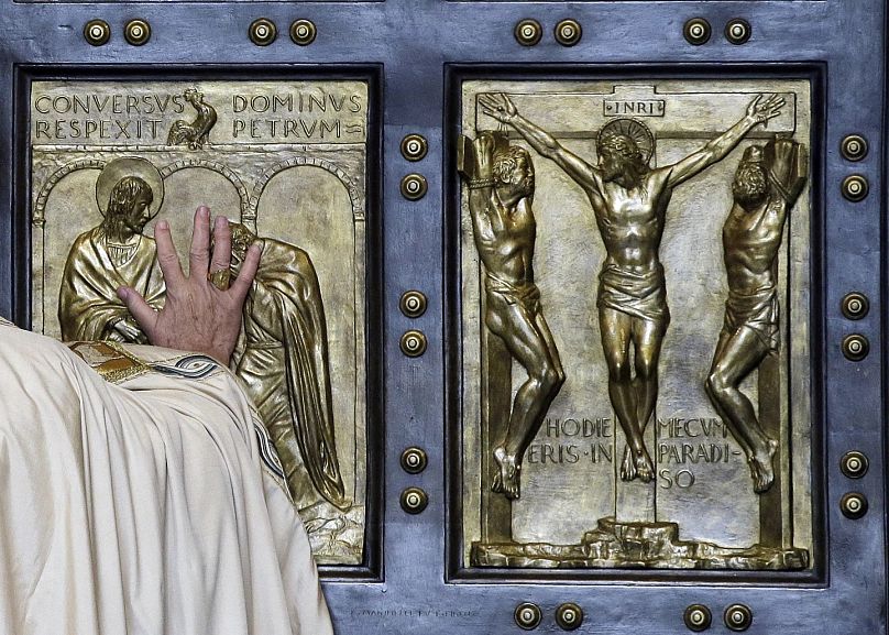 Pope Francis pushing the Holy Door in 2015