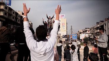 People celebrating in street of Baba Amr district