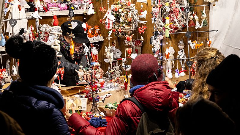 Visitors shop for Christmas gifts in Kaysersberg