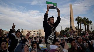 Syrians gather in celebration days after the fall of Bashar Assad's government at the Umayyad Square in Damascus, Thursday, Dec. 12, 2024.