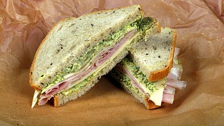 File: This photo shows a ham and cheese sandwich with green spread, styled by Sarah Abrams, displayed at the Institute of Culinary Education in New York, US, 4 August, 2016.