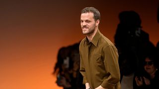 Matthieu Blazy accepts applause after the conclusion of the Bottega Veneta women's Fall-Winter 2024-25 collection presented in Milan, Italy, Feb. 24, 2024.