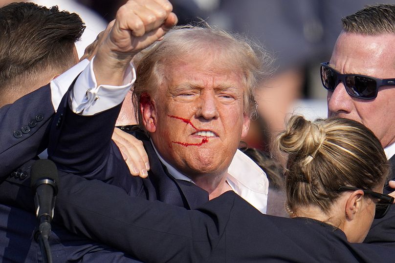 Donald Trump reacts following an assassination attempt at a campaign event in Butler, Pa., on Saturday, July 13, 2024.
