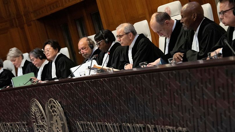Presiding Judge Nawaf Salam, fourth from right, opened hearings at the World Court in The Hague on 2 December.