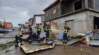 Rescue workers clearing an area in Mayotte after Cyclone Chido caused extensive damage with reports of several fatalities, 14 December, 2024