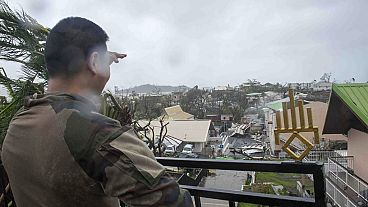 A soldier observes the damage on the French territory of Mayotte in the Indian Ocean, following the passage of cyclone Chido, in Mayotte on 15.12.2024