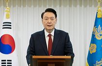 In this photo released by South Korean President Office via Yonhap, South Korean President Yoon Suk Yeol speaks at the presidential residence in Seoul, South Korea, December. 