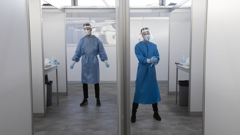 Medical staff wait for the next in line for a COVID-19 test in the Netherlands in 2020.
