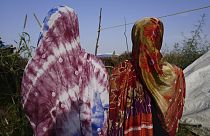 FILE PHOTO: Women who fled war in Sudan and requested anonymity because they feared retribution after reporting rape walk in a refugee camp in Adre, Chad, 5 October, 2014