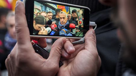 Calin Georgescu, outside a closed voting station after Romania's Constitutional Court annulled the first round of presidential elections 08/12/24 (AP Photo/Vadim Ghirda)