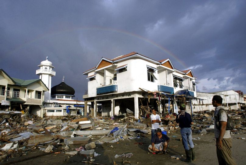 A rainbow is formed Friday Dec. 31, 2004 at the devastated commercial district of Banda Aceh, the capital of Aceh province.