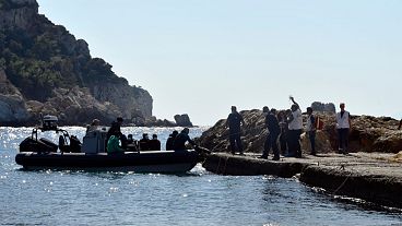 Members of Doctors Without Borders and coast guards officers help a pregnant woman to embark on a vessel with other survivors in Greece, 23 September 2024. Members of Doctors Without Borders and coast guards officers help a pregnant woman to embark on a vessel with other survivors in Greece, 23 September 2024.