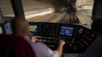 A subway driver operates the train's brake lever before entering a station in Barcelona, Spain, Monday, December 2, 2024.