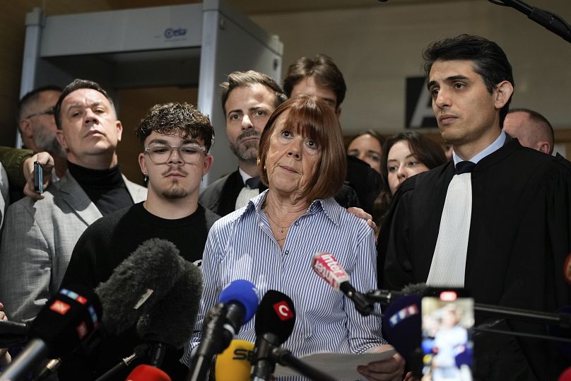 Gisele Pelicot speaks to the press as she leaves the courtroom, in the Avignon courthouse, southern France, Thursday, Dec. 19, 2024.