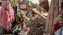 A young girl walks in the Kaweni slum on the outskirts of Mamoudzou, in the French Indian Ocean island of Mayotte after Cyclone Chido, Thursday, Dec. 19, 2024. 