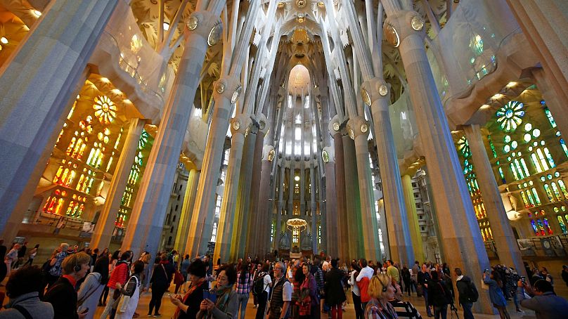 Tourists visit the Sagrada Familia church in 2015.