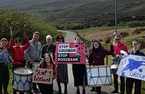 Climate activists protest the controversial untapped oil field in Shetland