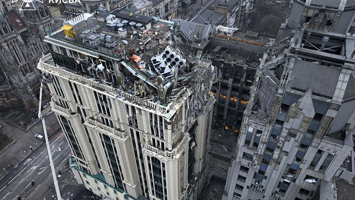 n this photo provided by the Ukrainian Emergency Service, firefighters work on the site of a damaged building after a Russian missile attack in Kyiv, Ukraine, Friday, Dec. 20,