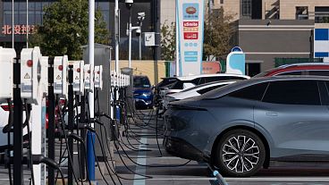 Electric vehicle charging stations are seen in Beijing, October 2024. 