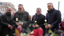 Leader of AfD party Tino Chrupalla pays tribute to victims outside St. John's Church in Magdeburg.