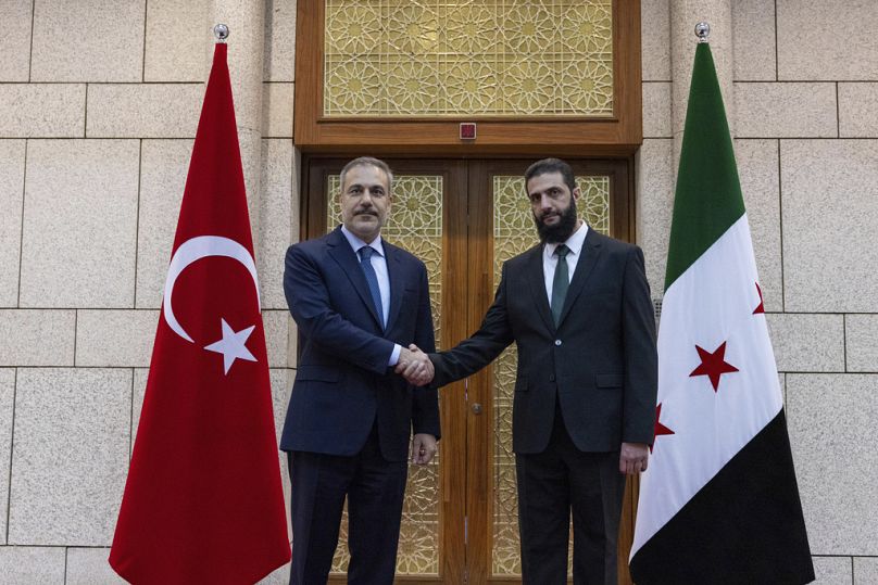 Turkish Foreign Minister Hakan Fidan and Ahmad al-Sharaa, formerly known as Abu Mohammed al-Jolani, during their meeting in Damascus, Syria.