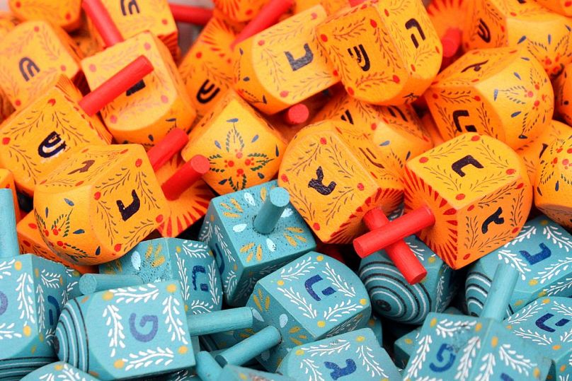 Dreidels are traditionally played with during the Jewish holiday of Hanukkah