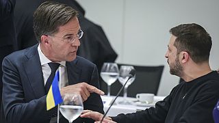 FILE: NATO Secretary General Mark Rutte, left, speaks with Ukraine's President Volodymyr Zelenskyy at the NATO Headquarters in Brussels, Thursday, Oct. 17, 2024.