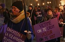 Activists of the feminist group NousToutes stage a demonstration outside the Louvre calling for better justice for rape victims after 50 men were convicted of raping Pelicot