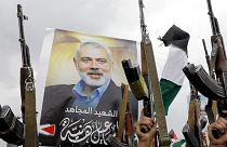 Yemeni protesters raise their machine guns during a protest to condemn the killing of Hamas leader Ismail Haniyeh, in Sanaa, 2 August 2024
