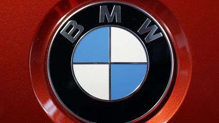 This Tuesday, March 21, 2017, file photo shows the logo of German car manufacturer BMW on a BMW M6 Coupe car during the company's earnings news conference in Munich, Germany. 
