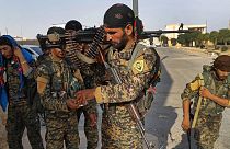 FILE: Kurdish-led fighters backed by the US prepare for battle against Islamic state group militants, in Raqqa, 22 June 2017