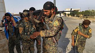 FILE: Kurdish-led fighters backed by the US prepare for battle against Islamic state group militants, in Raqqa, 22 June 2017