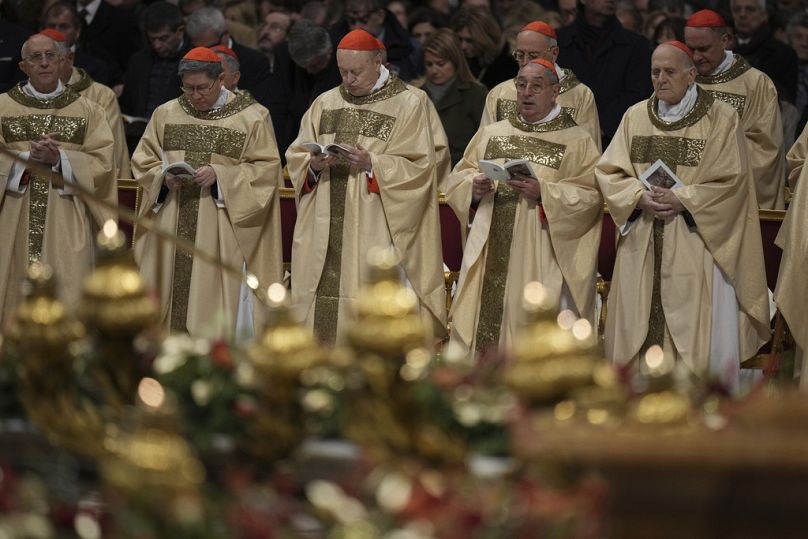 Cardinals attend the Christmas Eve Mass presided over by Pope Francis in St. Peter's Basilica at The Vatican, Tuesday, Dec. 24, 2024