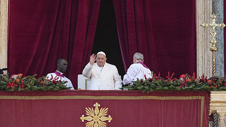 Pope Francis waves before delivering the Urbi et Orbi Christmas' day blessing from the main balcony of St. Peter's Basilica at the Vatican, Wednesday, Dec. 25, 2024.