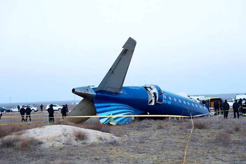 Azerbaijan Airlines' Embraer 190 lies on the ground near the airport of Aktau, Kazakhstan, on Thursday, Dec. 26, 2024.