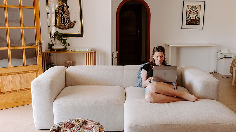 A member catches up on work while home-swapping