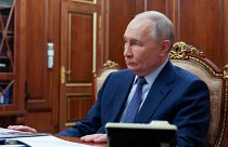 Russian President Vladimir Putin meets with Emergency Situations Minister Alexander Kurenkov at the Kremlin in Moscow, Russia, Friday, Dec. 27, 2024.