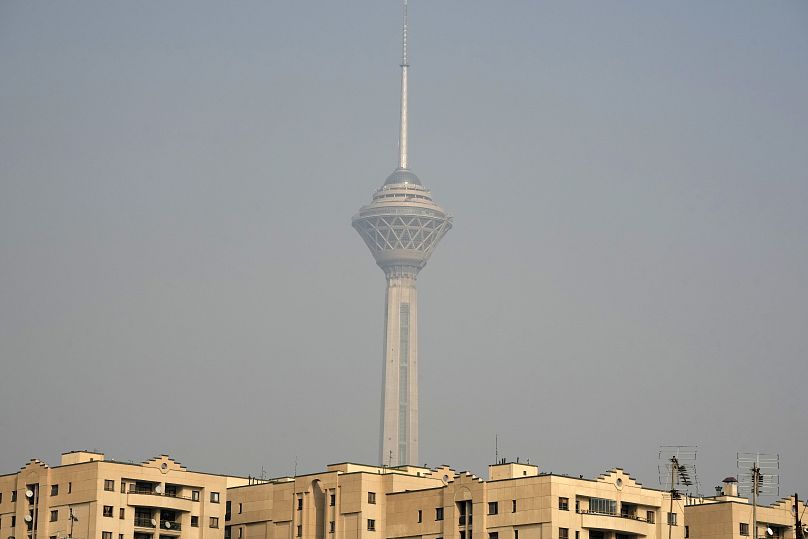 Milad telecommunication tower and buildings are seen amid air pollution in Tehran, Iran, Wednesday, Dec. 11, 202