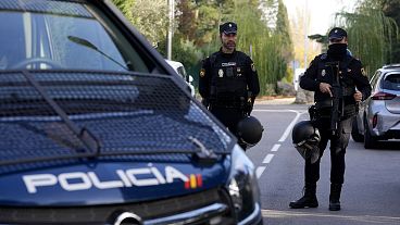 FILE- Police officers stand guard in Madrid, 30 November 2022