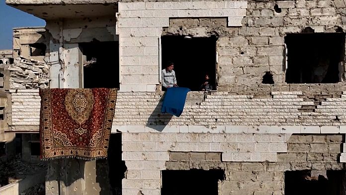 Elderly Syrian couple returns to ruined home in Harasta, hopeful despite destruction