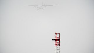 A plane lands in the mist at Cardiff Airport, in Cardiff, Wales, Saturday, Dec. 28, 2024.